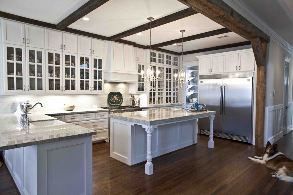 white kitchen with rustic beams